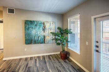 Wood-style plank flooring in kitchen and living areas